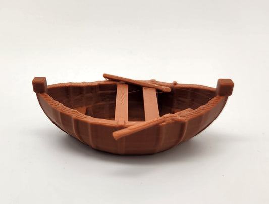 Referans görsel — model: Rowboat Miniature · tasarım: Triple G Workshop · lisans: BY. Wefty Design'in kendi baskısının fotoğrafı değildir.
